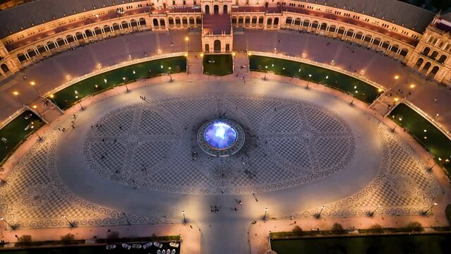 4k Aerial view of Plaza de Espana at sunrise in Seville, Spain. Night view of Maria Luisa Park