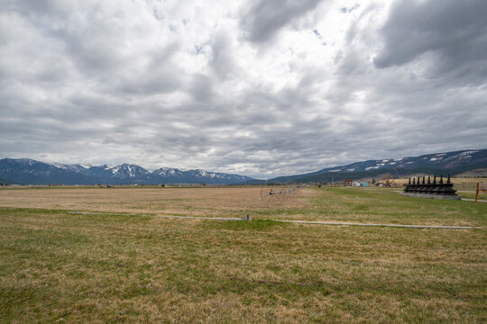 Wide open land acreage in the Big Sky state of Montana, at the small town of Arlee, Montana, with snow capped mountains in the distance.
