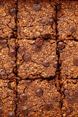 Close-up brownies with chocolate chips and rolled oats, macro texture.