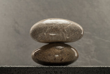 wet zen stones on dark background for product presentation background podium