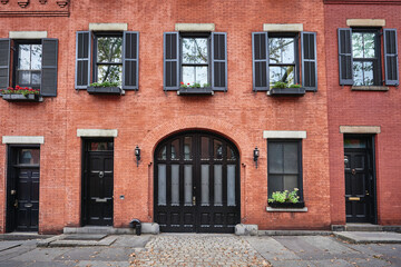 a beautiful brownstone building on an iconic street of Manhattan, NYC.