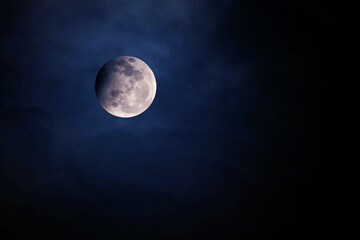 Naklejka na ściany i meble The moon in space on a dark background. Elements of this image furnishing NASA.
