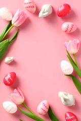 Happy Easter poster design, vertical banner template. Frame made of Easter eggs, rabbits, tulips on pink background.