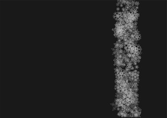 Fototapeta premium Silver snowflakes frame on black background. Horizontal shiny Christmas and New Year frame for gift certificate, ads, banners, flyers. Falling snow with glitter silver snowflakes for party invite