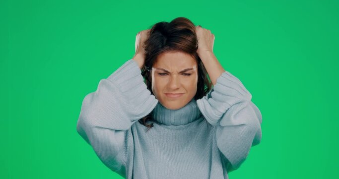 Woman, green screen and angry with pulling hair in studio for mental health, anxiety and shouting. Frustrated model, stress and psychology problem with trauma, bipolar or schizophrenia by background