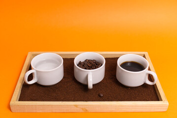 coffee cups on orange background