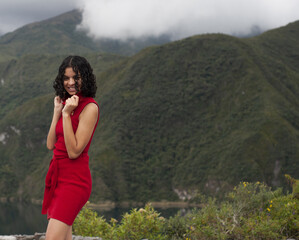 young woman dances freely in a beautiful natural landscape