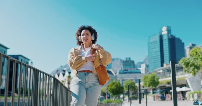 Black woman outdoor, running and late for appointment, stress and anxiety in town, headphones and tired. African American female, lady and employee tired, time management and in city with frustration