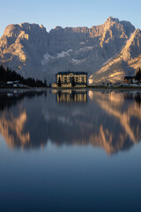 Pio XII hospital reflecting in Lake Misurina, Cortina d'Ampezzo, Italy