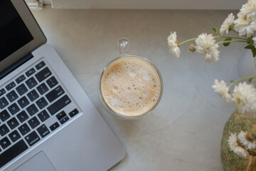 Coffee with laptop on the table