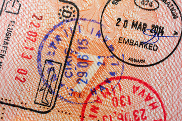 Stamps in a travel passport, entry and exit stamp, emigration, immigration, tourism concept