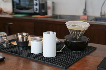 Barista preparing coffee pour over coffee maker and drip kettle. Coffee shop concept. vintage tone.