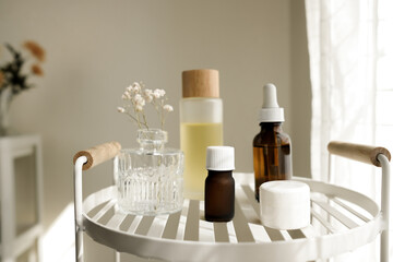 The natural skincare bottle on the white shelf in the bathroom for self-care and beauty concept. Selective focus