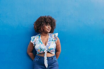 Portrait of a black woman with Afro hair in the open air