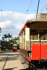 Two old tram cars on the track of the Brisbane Tramway Museum, Australia