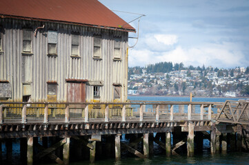 Historic Cannery Buildings at the Semiahmoo Resort in Drayton Harbor, Washington. The city of White Rock, British Columbia can be seen in the background.