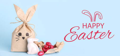 Easter greeting card with gift bag, toy bunny and candies