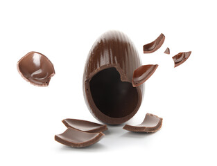 Broken chocolate Easter egg on white background