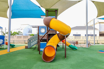 View of children's playground with slides in city