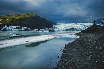 Iceland's landscapes are a breathtaking blend of ice and fire, where glaciers and volcanoes coexist. These photos showcase the island's raw beauty, from black sand beaches to towering waterfalls and a - 578873770
