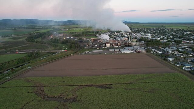 Spectacular sunrise and sunset at Proserpine Queensland Australia with sugar mill in full operation in the background