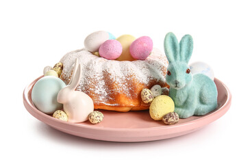 Plate with tasty Easter cake, eggs and bunnies on white background