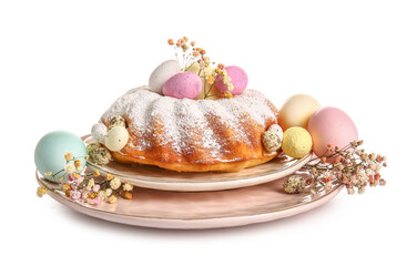 Plate with tasty Easter cake, eggs and gypsophila flowers on white background