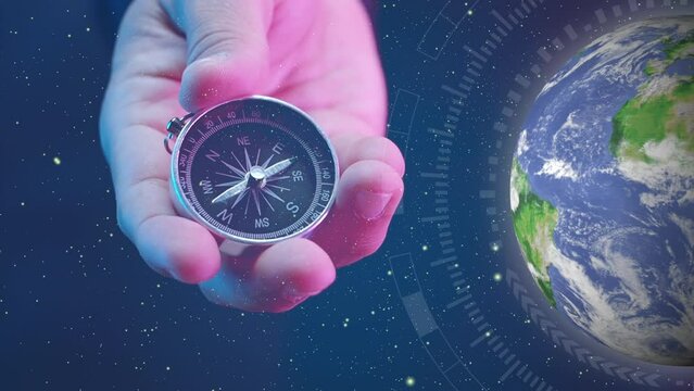 Businessman with a compass holding in hand and virtual planet earth background. Define marketing direction and search customer global network. Concept of strategic orientation in business or marketing
