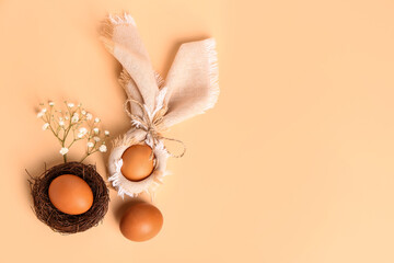 Composition with natural Easter eggs and gypsophila flowers on color background