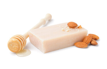 Soap bar, almond nuts and honey on white background