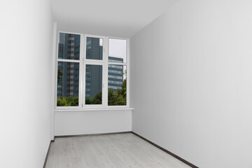 Empty office room with clean window and white walls. Interior design