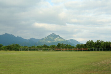 Picturesque landscape with beautiful high mountains under cloudy sky