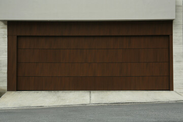Building with brown sectional garage door outdoors