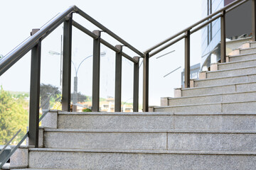 Stairs with metal handrailing outdoors on sunny day