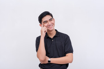 A smart man relishing his cleverness. Index finger placed on temple. Isolated on a white background.