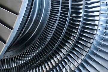 Shiny blades of high-speed steam turbine in workshop