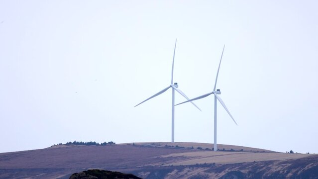 Wind turbines on Haramsfjellet, just outside the city of &Aring;lesund in Norway.
