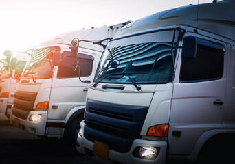 Naklejka premium Trucks lined up in the parking lot. Delivery trucks. Freight trucks cargo transport, logistics