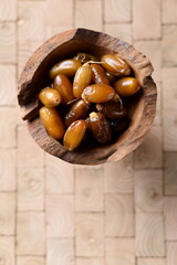 palm/ date fruit in wooden bowl