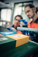 Fototapeta premium Multiracial tachnicial engineer training with robot arm