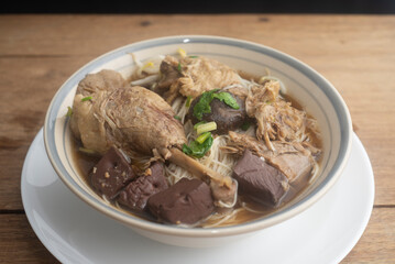 Duck noodles in bowl on wooden table  Thai food.