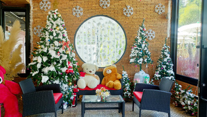 Christmas Decorations in living room at home with Christmas tree, Bear, Gift box. December, 25, 2022 Christmas surprises	
