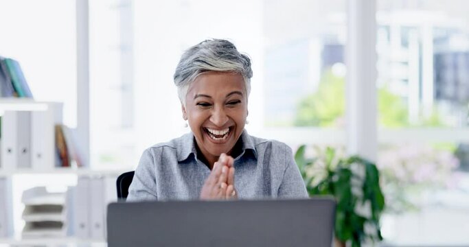 Senior woman, laptop and office with celebration, happiness and surprise with winning, goals or achievement. Indian executive, applause and computer with wow, celebrate or yes for stock market profit