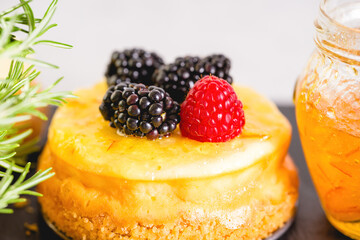 Mini cheesecake with fresh berries, and fruit jelly close-up