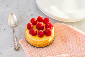Classic mini cheesecake with fresh raspberries.