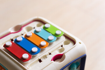 Close up colorful xylophone with blurry wooden floor background