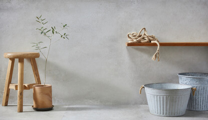 Fototapeta na wymiar retro style, Basket, olive tree, earthen pot, stool and various objects on vintage gray concrete background