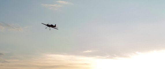 Fototapeta na wymiar airplane model on the runway at sunset
