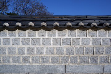Traditional brick wall and tile roof. Korean traditional historic building wall. brick wall material for background and design.