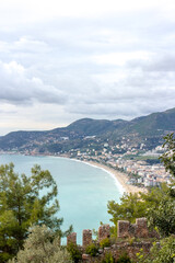 Fototapeta premium Top view of the bay area, old city, fortress, sea and mountains in Alanya, Turkey